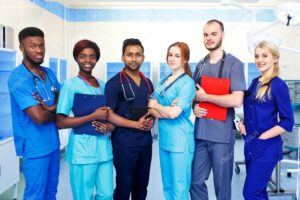 Multiracial team of young doctors in a hospital standing in a operating room